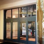 Glazed Vertical Lift Door with Mandoors on the Liberty Place in Philadelphia, PA 
